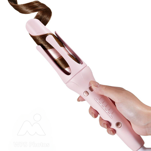 Darziq automatic curling iron for healthy, beautiful curls with sleek design and easy operation in a health and beauty setting.