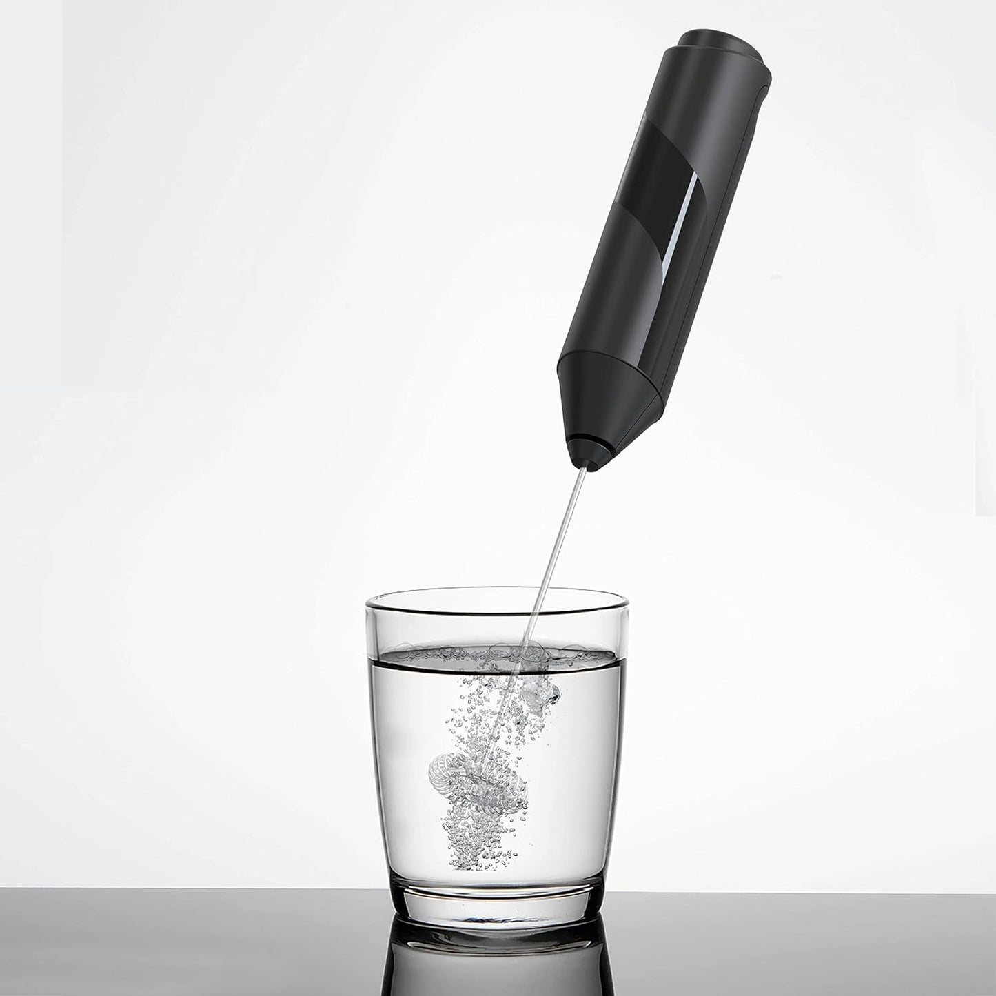Darziq electric milk frother for home and kitchen, showing a frothing pitcher with creamy milk foam ready to serve.