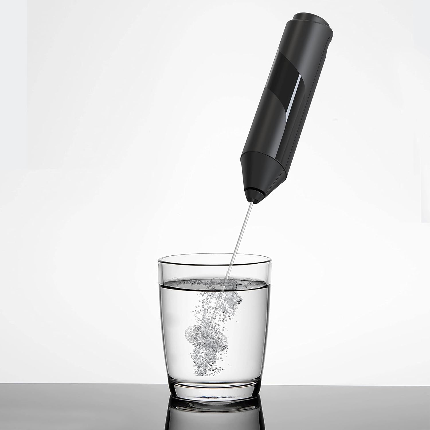 Darziq electric milk frother for home and kitchen, showing a frothing pitcher with creamy milk foam ready to serve.