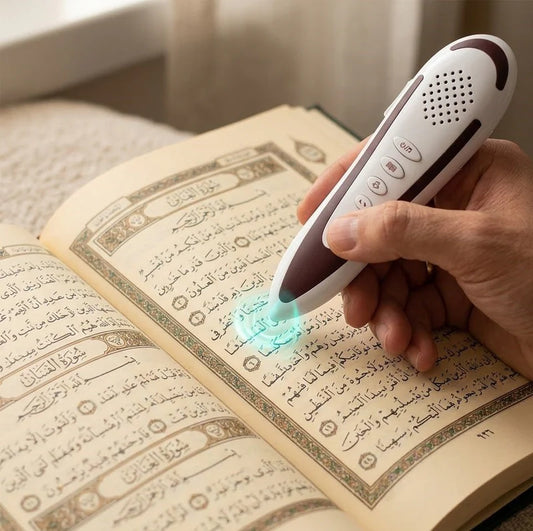 Dar Al Ghalah Quran reading pen by Darziq, a sleek black tech device with a button and speaker for audio Quran recitation.